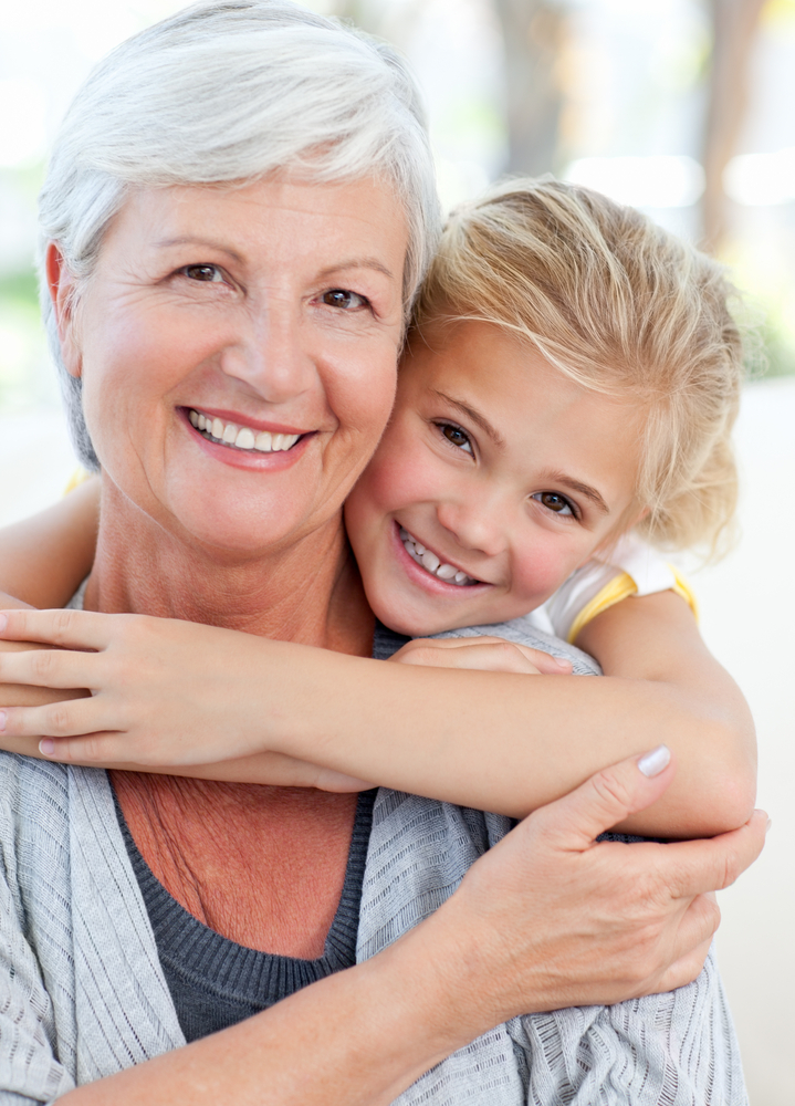 Lovely little girl with her grandmother looking at the camera Lovely little girl with her grandmother looking at the camera